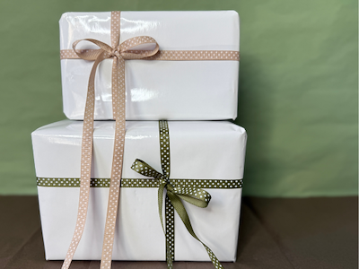 White coated paper 55cm x 100 meters. With glossy UV varnish