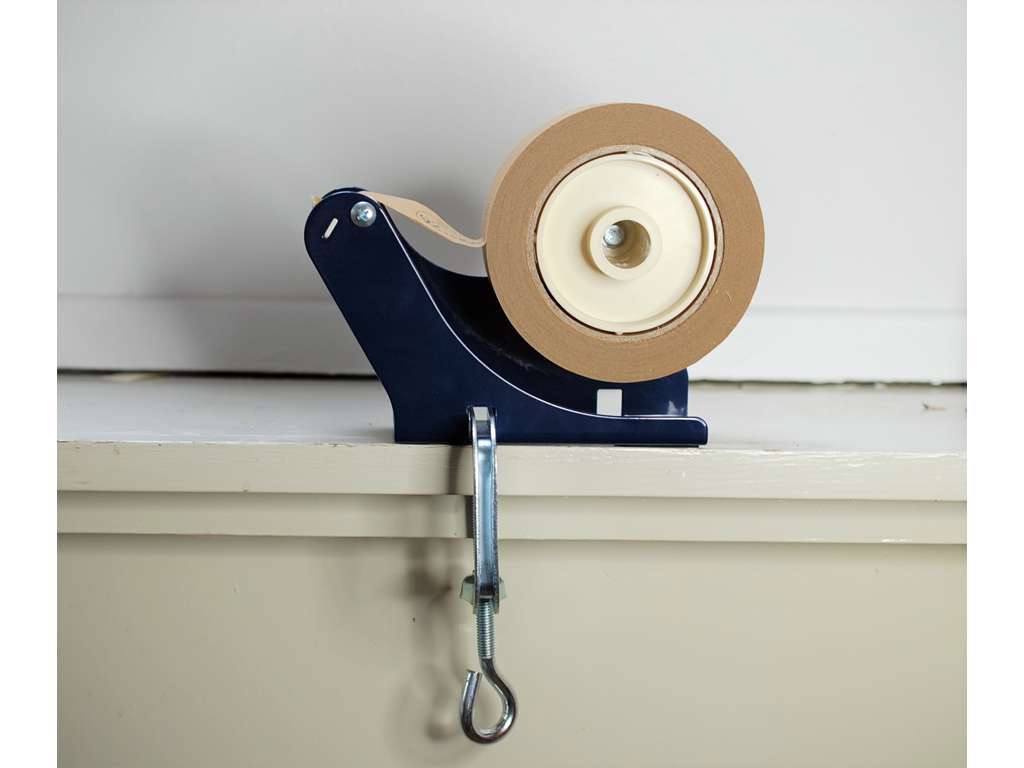 Table dispenser with screw clamp