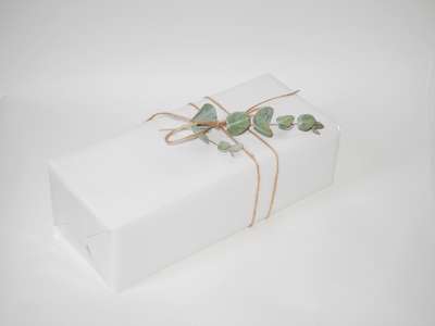White coated paper 55cm x 100 meters. With glossy UV varnish
